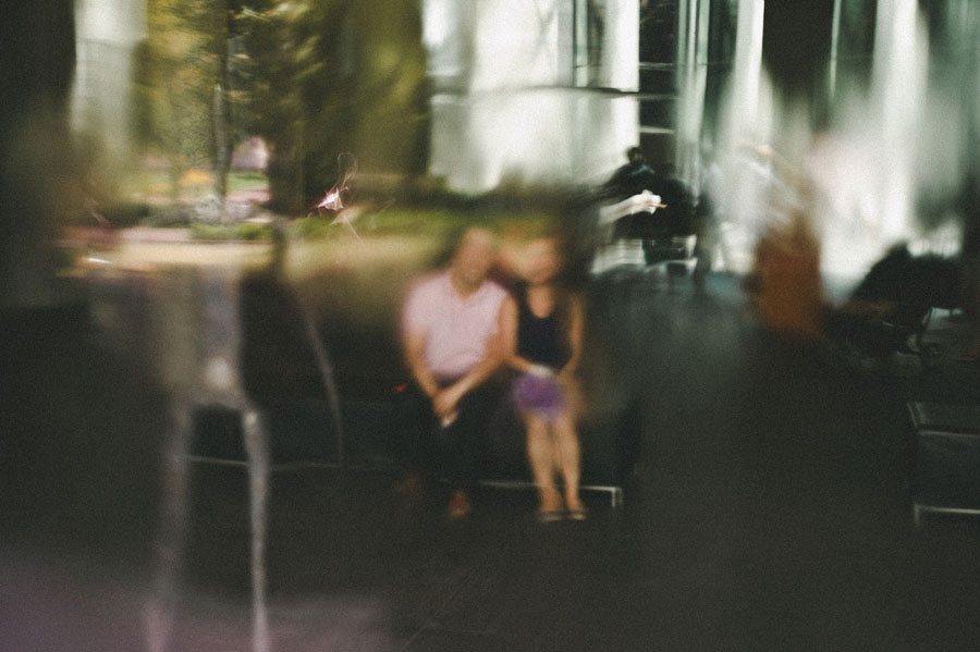 Melbourne engaged couple behind water wall NGV