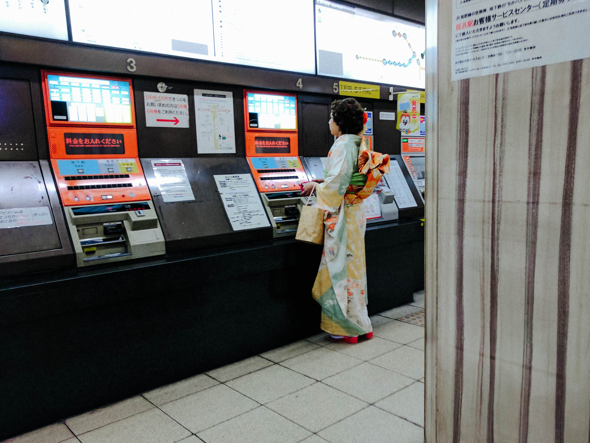 woman-wearing-furisode-coming-age-japan-ticket-machine