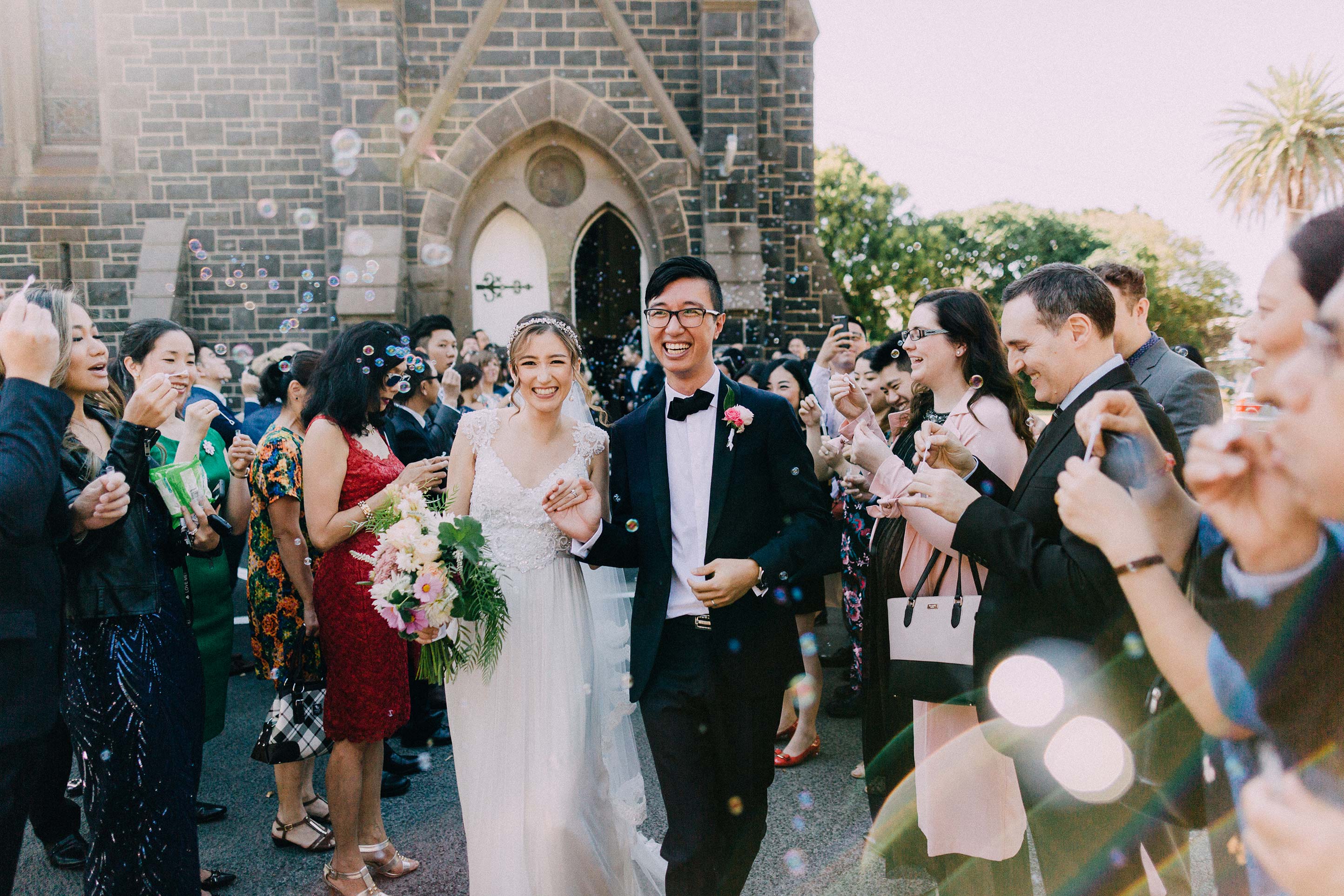 Melbourne-caufield-north-wedding-church-ceremony-exit-bubbles