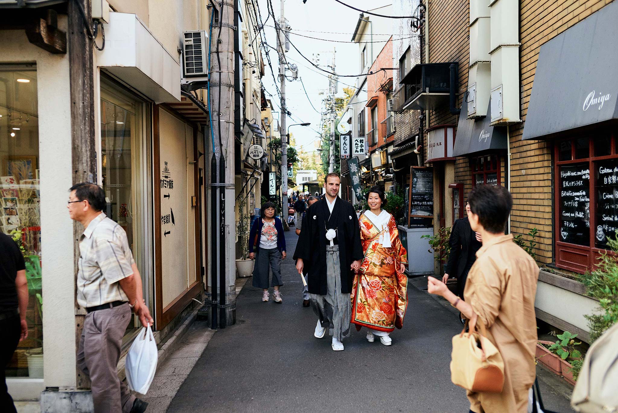 tokyo asakusa shrine traditional wedding walking along crowded alleys