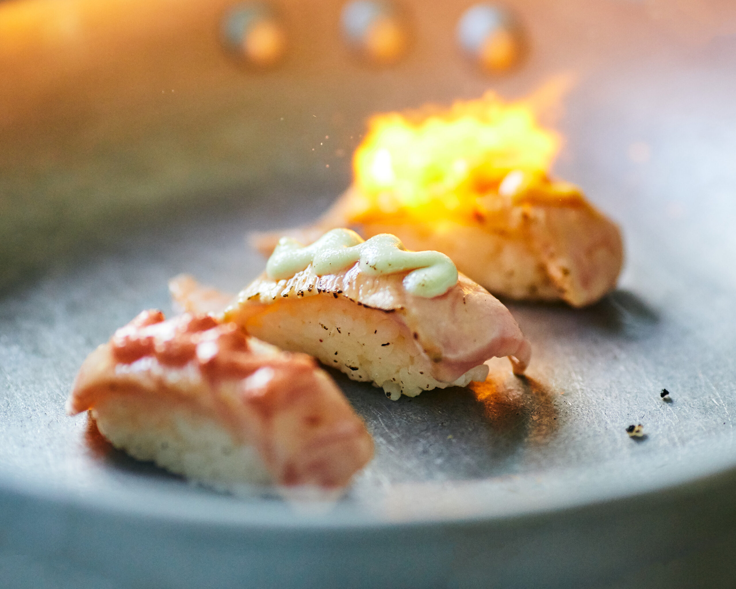 close-up-photo-aburi-salmon-nigiri-sushi