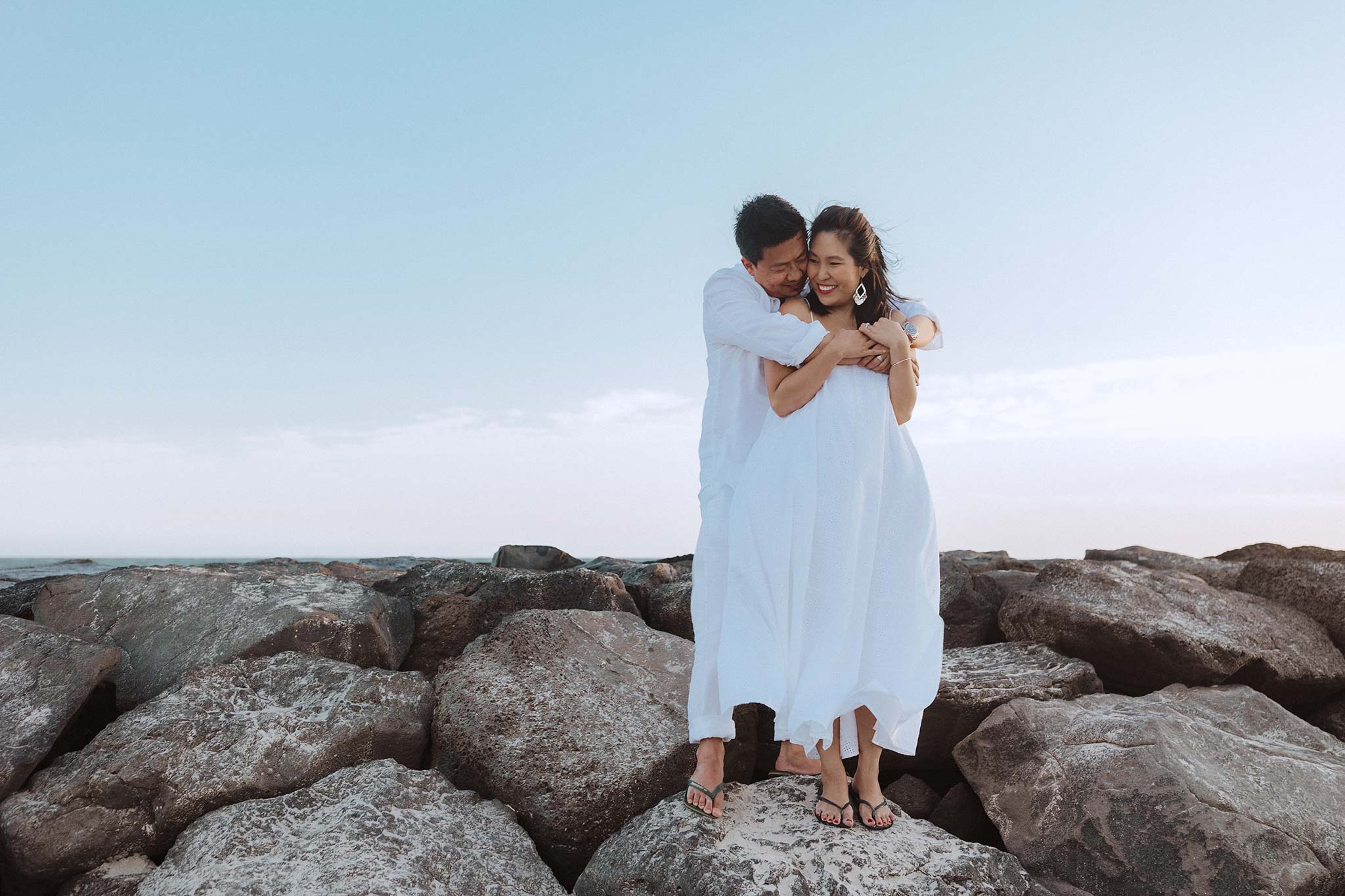 Melbourne Williamstown Pre Wedding Engagement couple embrace in white